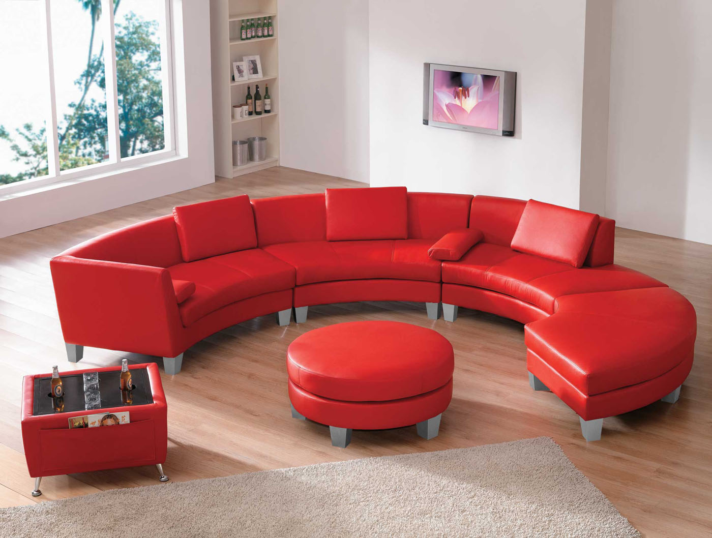 Contemporary-Living-Room-Sets-with-U-Shaped-Red-Sofa-Living-Room-near-Round-Shaped-Red-Leather-Coffee-Table-Ottoman-plus-Wooden-Flooring-also-White-Wall-Paint-and-Glass-Windows-Set