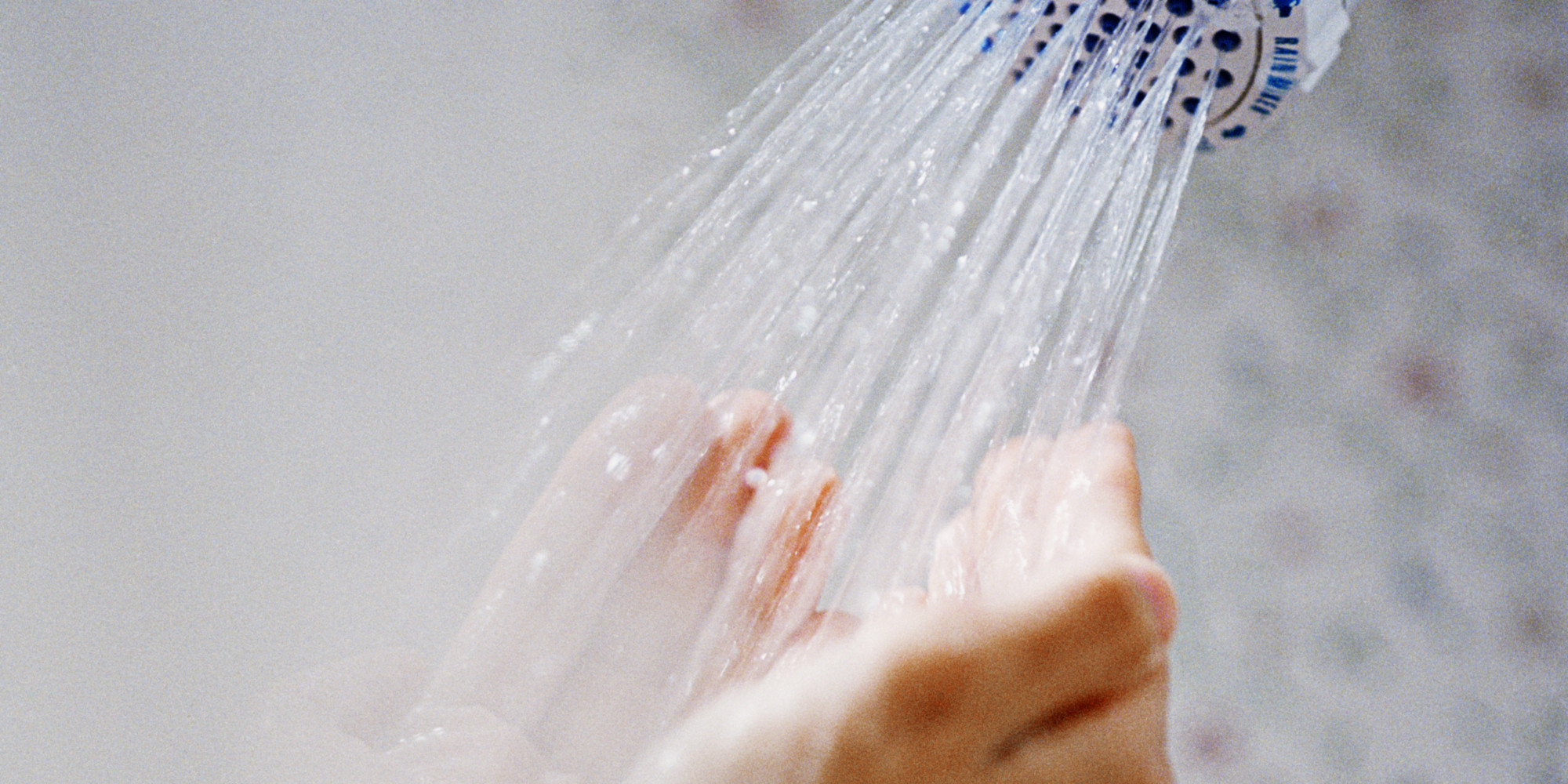 Cupped Hands Under Shower