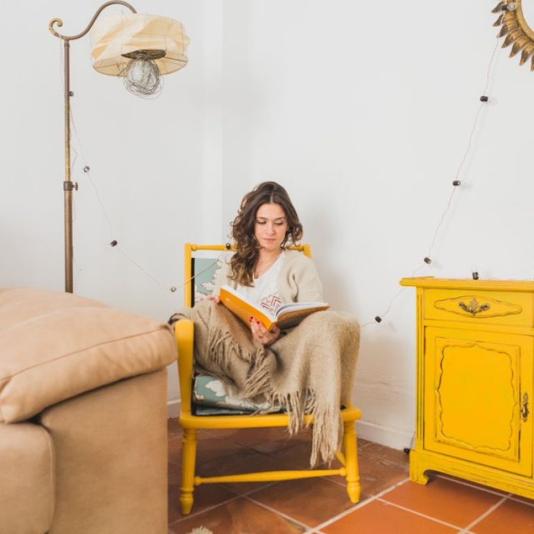 girl-reading-book-sitting-chair