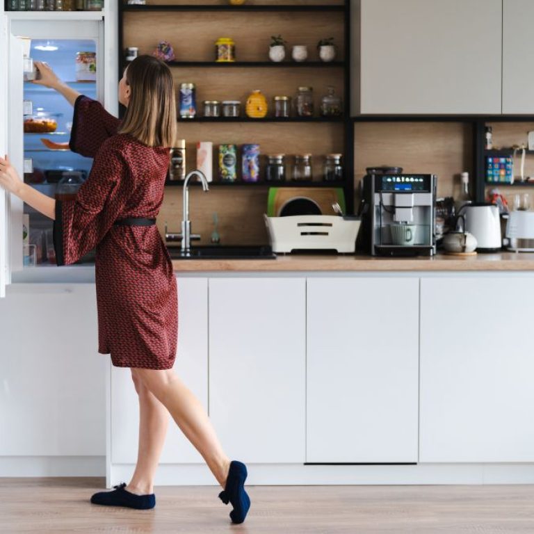 hungry-woman-looking-food-fridge-home-dont-have-much-there-white-kitchen-furniture-home-wear-red-silk-robe