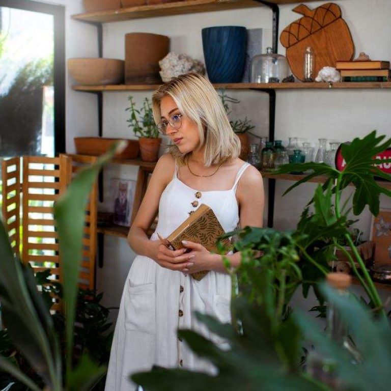 medium-shot-young-woman-surrounded-by-plants