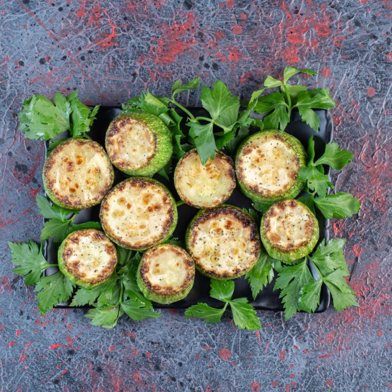 parsley-leaves-adorning-platter-fried-zucchini-dark-colored-background-high-quality-photo