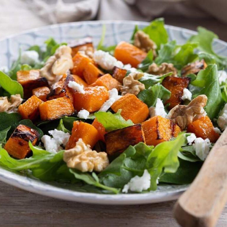 pumpkin-salad-with-walnuts-feta-cheese-wooden-table_123827-34070