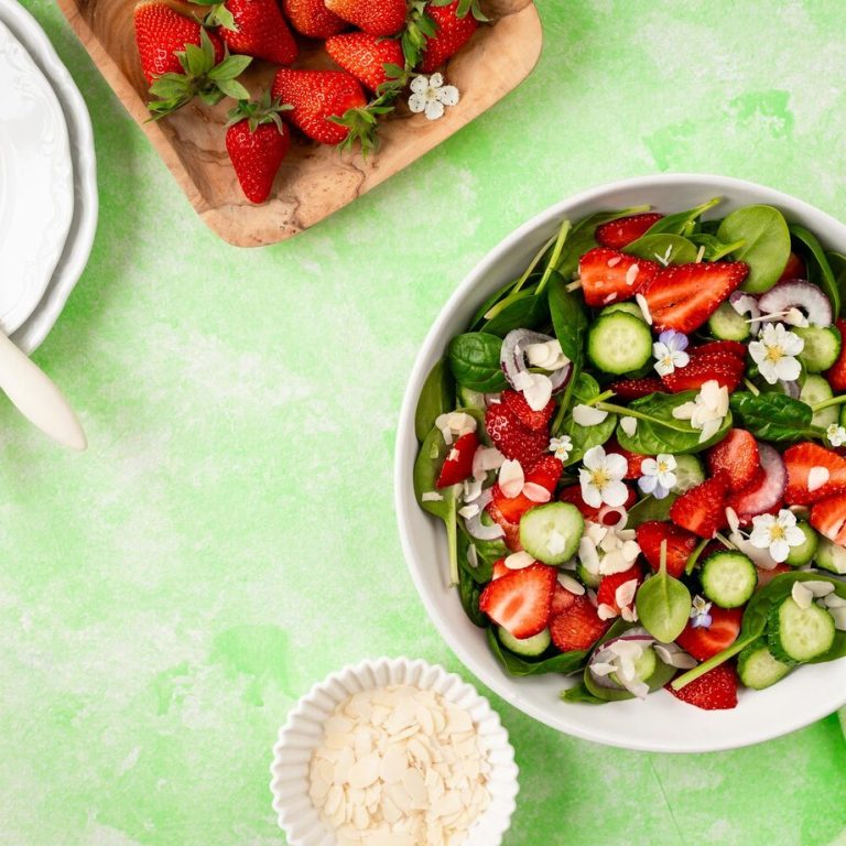 strawberry-spinach-salad-green-background_127032-3540
