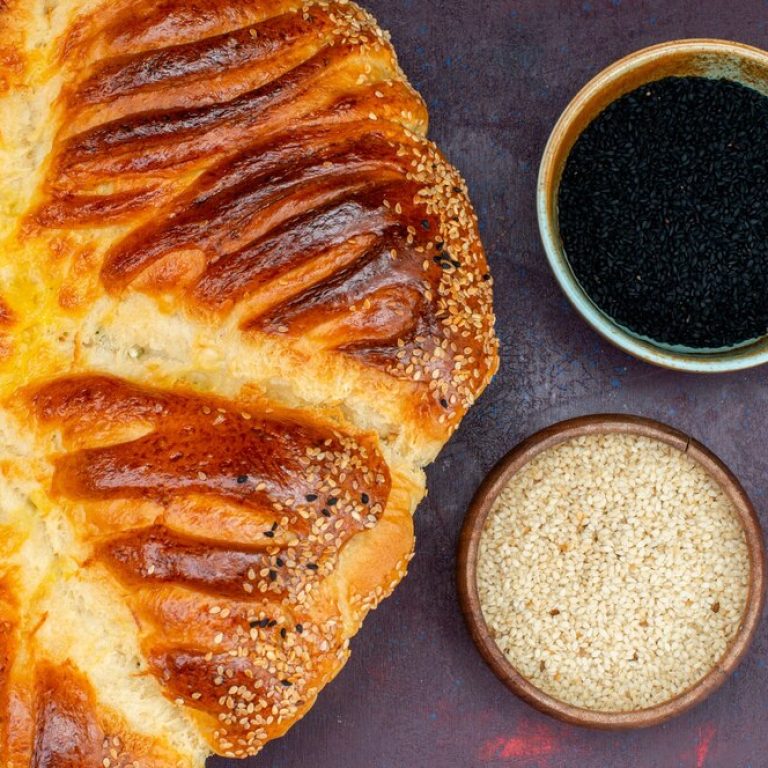 top-close-view-baked-pastry-bun-formed-with-raw-rice-dark-background_140725-49806