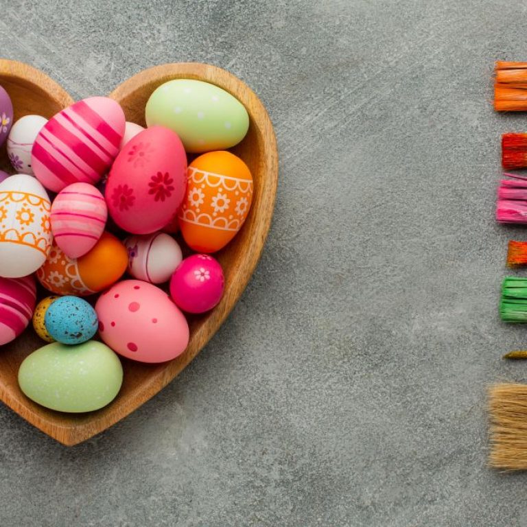 top-view-colorful-easter-eggs-heart-shaped-plate-with-assortment-paint-brushes