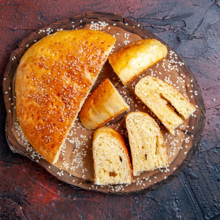 top-view-delicious-sweet-pastry-sliced-pieces-dark-surface