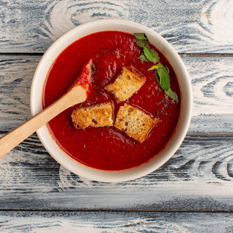 top-view-delicious-tomato-soup-with-rusks-inside-grey-table-soup-food-meal-dinner