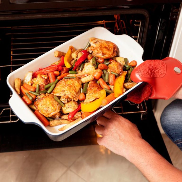 tray-food-being-put-into-oven-cook