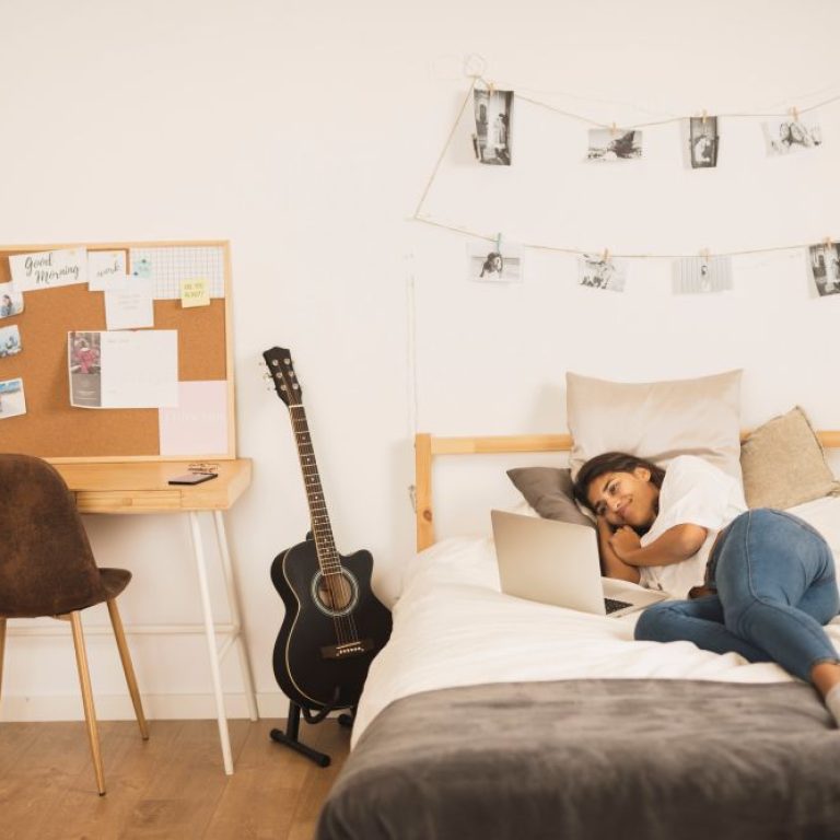 woman-bed-working-laptop