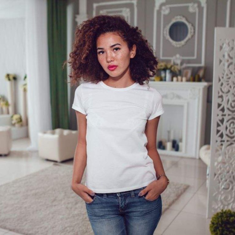 woman-stands-room-with-white-wall-her